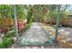 Backyard bocce ball court surrounded by lush landscaping at 3004 Bay Shore Cir, Sarasota, FL 34234
