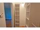 Walk-in closet with custom shelving at 3004 Bay Shore Cir, Sarasota, FL 34234