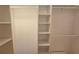 Walk-in closet with custom shelving offers great storage at 3004 Bay Shore Cir, Sarasota, FL 34234