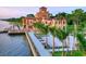 An elegant estate with architectural details, manicured landscaping, and serene waterfront views at 3004 Bay Shore Cir, Sarasota, FL 34234