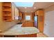 Well-lit kitchen featuring granite countertops, wood cabinets, and modern stainless steel appliances at 3004 Bay Shore Cir, Sarasota, FL 34234
