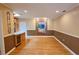 Inviting living area showcases hardwood floors, recessed lighting, and seamless connection to the kitchen at 3004 Bay Shore Cir, Sarasota, FL 34234