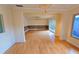 Bright living area boasts hardwood floors, a ceiling fan, and sliding doors that lead to the outdoors at 3004 Bay Shore Cir, Sarasota, FL 34234