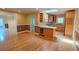Open concept living area boasts hardwood floors, a wine cooler, and a seamless flow to the kitchen at 3004 Bay Shore Cir, Sarasota, FL 34234