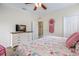 Comfortable bedroom featuring a television, closet, and decorative dream catcher at 316 64Th St, Holmes Beach, FL 34217