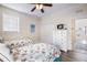 Inviting bedroom with two twin beds, a dresser, and access to a nearby bathroom at 316 64Th St, Holmes Beach, FL 34217