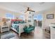 Bright bedroom with access to a balcony, featuring stylish decor and hardwood floors at 316 64Th St, Holmes Beach, FL 34217
