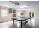 Spacious game room featuring a ping pong table and access to the outdoor area at 316 64Th St, Holmes Beach, FL 34217