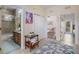 Hallway with bathroom, laundry closet, and views to bedrooms and outdoor deck at 316 64Th St, Holmes Beach, FL 34217