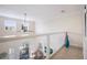 Spacious loft with large windows, a ceiling fan, and a view of the balcony at 316 64Th St, Holmes Beach, FL 34217