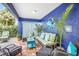 Inviting outdoor patio with comfortable seating, vibrant decor, and tropical plants at 316 64Th St, Holmes Beach, FL 34217