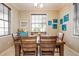 Dining room with natural light and seating for four at 318 64Th St, Holmes Beach, FL 34217