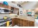 Open kitchen features a breakfast bar overlooking the living area at 318 64Th St, Holmes Beach, FL 34217