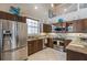 Modern kitchen with stainless steel appliances, granite countertops, and ample cabinet space at 318 64Th St, Holmes Beach, FL 34217