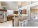 Well-equipped kitchen featuring stainless steel appliances, granite countertops, and a breakfast bar with seating at 318 64Th St, Holmes Beach, FL 34217