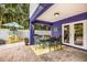 Charming patio with dining area, grill and tiki bar for relaxed outdoor living at 318 64Th St, Holmes Beach, FL 34217