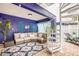 Stylish outdoor patio featuring a cozy seating area and spiral staircase for easy access at 318 64Th St, Holmes Beach, FL 34217