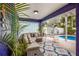 Comfortable outdoor seating area with spiral staircase to another level and pool views at 318 64Th St, Holmes Beach, FL 34217