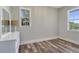 An empty bedroom with natural light from 2 windows and hardwood floors at 32 Palm Dr, Placida, FL 33946