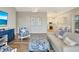 Inviting living room with coastal decor, a white sofa, and an open layout flowing into the kitchen at 32 Palm Dr, Placida, FL 33946