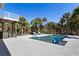 Relaxing backyard pool with lounge seating and beautiful landscaping, perfect for entertaining at 32 Palm Dr, Placida, FL 33946