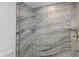Modern bathroom featuring stunning green marble tile in the shower at 33 S Gulfstream Ave # 905, Sarasota, FL 34236