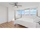 Bright bedroom with hardwood floors, ceiling fan, and a window view at 33 S Gulfstream Ave # 905, Sarasota, FL 34236
