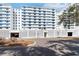 Contemporary condominium building with decorative concrete fencing and covered parking at 33 S Gulfstream Ave # 905, Sarasota, FL 34236