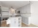 Well-lit modern kitchen with gray cabinets, marble countertops, and stainless steel appliances at 33 S Gulfstream Ave # 905, Sarasota, FL 34236