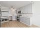 Bright kitchen featuring gray cabinetry, stainless steel appliances, and a mobile island at 33 S Gulfstream Ave # 905, Sarasota, FL 34236