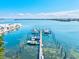 Aerial view of the boat dock, showcasing multiple boats and scenic waterfront at 3540 Gulf Of Mexico Drive # 202, Longboat Key, FL 34228