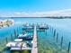 Aerial view of the boat dock, showcasing multiple boats and scenic waterfront at 3540 Gulf Of Mexico Drive # 202, Longboat Key, FL 34228