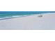Beautiful beach featuring sun loungers on the white sand for a peaceful retreat at 3540 Gulf Of Mexico Drive # 202, Longboat Key, FL 34228