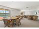 Spacious community room with plenty of seating, tables and big windows with beach views at 3540 Gulf Of Mexico Drive # 202, Longboat Key, FL 34228