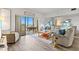 Bright living area featuring access to the screened in porch and view of the water at 3540 Gulf Of Mexico Drive # 202, Longboat Key, FL 34228