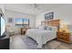 This main bedroom boasts water views, a desk, and wood floors at 3540 Gulf Of Mexico Drive # 202, Longboat Key, FL 34228