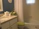 Well-lit bathroom featuring a vanity with a granite countertop and a bathtub with a shower at 3620 Ironwood Cir # 506-O, Bradenton, FL 34209