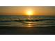 Sunset view over the water and beach at 3620 Ironwood Cir # 506-O, Bradenton, FL 34209