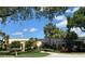 Low-rise community building with a covered walkway entrance and beautiful landscaping at 3620 Ironwood Cir # 506-O, Bradenton, FL 34209