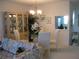 Comfortable dining area featuring elegant furniture, cabinetry, and natural lighting at 3620 Ironwood Cir # 506-O, Bradenton, FL 34209