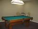 Cozy game room with a well-maintained pool table and adjacent seating area at 3620 Ironwood Cir # 506-O, Bradenton, FL 34209