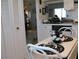 Cozy kitchenette featuring essential appliances, white cabinets and a dining table with chairs at 3620 Ironwood Cir # 506-O, Bradenton, FL 34209