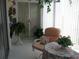 Bright lanai featuring comfortable seating, a table, and views of the surrounding greenery at 3620 Ironwood Cir # 506-O, Bradenton, FL 34209