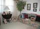 Inviting living room with floral sofa, table and lamp beside a window at 3620 Ironwood Cir # 506-O, Bradenton, FL 34209