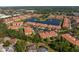 Aerial view of the neighborhood's layout, featuring a central lake, community spaces and well-maintained landscaping at 3671 Parkridge Cir # 8-201, Sarasota, FL 34243
