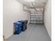 Spacious garage with gray epoxy flooring and an automatic door opener. Plenty of room for storage and vehicles at 3671 Parkridge Cir # 8-201, Sarasota, FL 34243