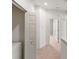 Hallway with carpet and a set of white doors at 3671 Parkridge Cir # 8-201, Sarasota, FL 34243