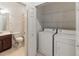 Laundry area located next to the bathroom at 3671 Parkridge Cir # 8-201, Sarasota, FL 34243