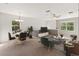 Bright living room featuring a dining area, comfortable seating, and a stylish entertainment center at 3671 Parkridge Cir # 8-201, Sarasota, FL 34243