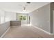 Neutral-toned loft features a ceiling fan, balcony and an open floor plan; perfect for entertaining at 3671 Parkridge Cir # 8-201, Sarasota, FL 34243
